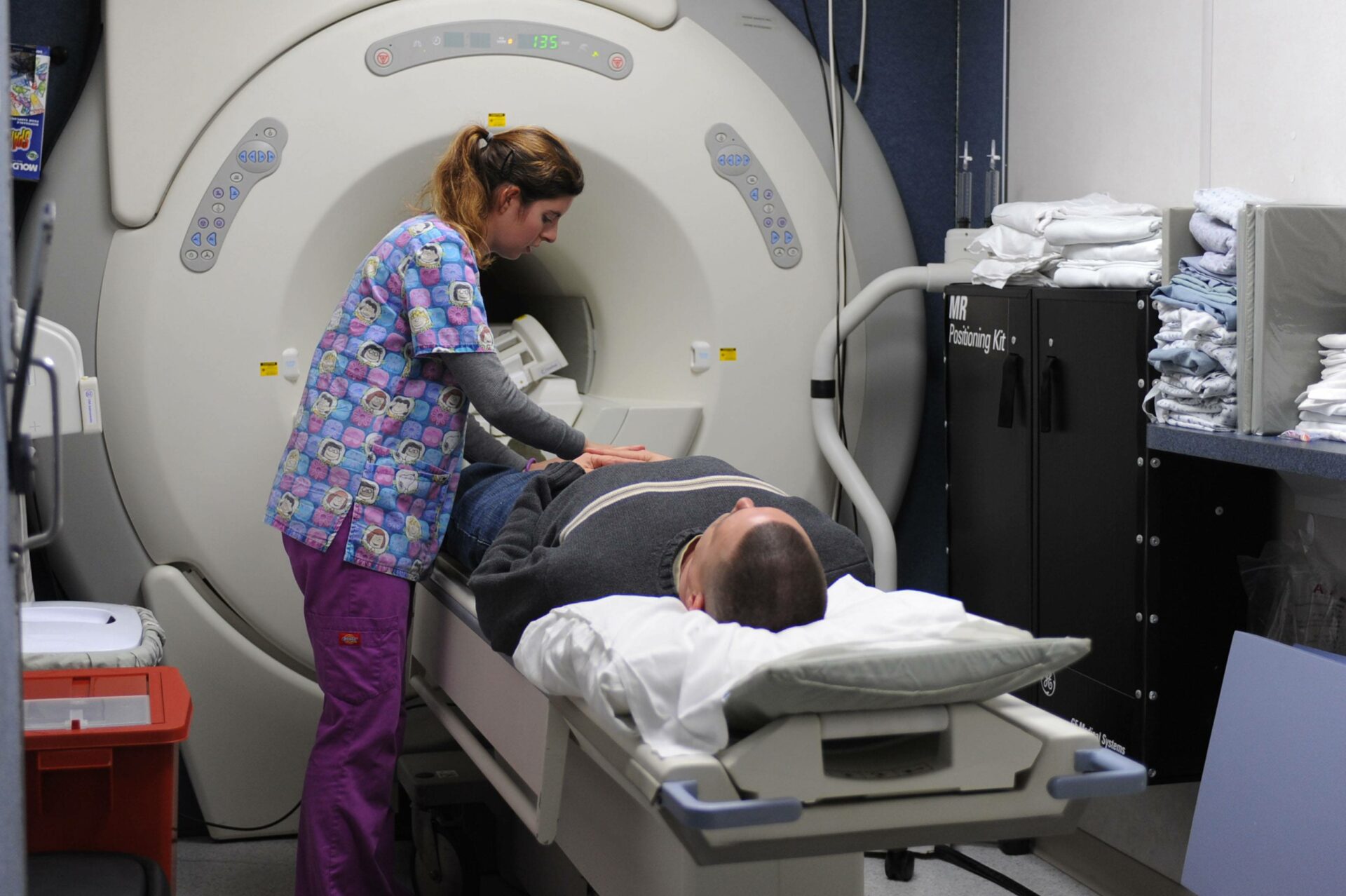 LANGLEY AIR FORCE BASE, Va. - Sarah Ivey, magnetic resonance imaging technician, prepares Chief Warrant Officer 3 Jeffrey Manninen, Army Logistics University instructor, for his scan Jan. 6 in the 633d Medical Group Radiology Department MRI trailer. With the addition of the MRI trailer, contracted with Alliance Imaging, patients can expect fewer delays in scheduling, appointment lengths and follow-up treatment. (U.S. Air Force photo/Senior Airman Brian Ybarbo)